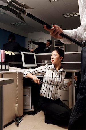 scared asian man - Fighting young men and young woman at office Stock Photo - Premium Royalty-Free, Code: 642-01737153