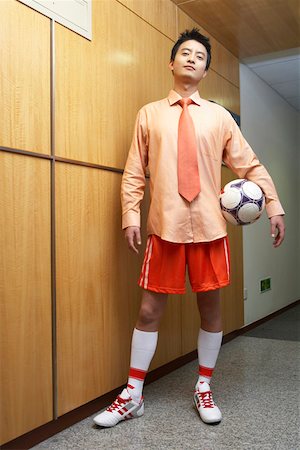 soccer portrait shot - Young man holding football, portrait Stock Photo - Premium Royalty-Free, Code: 642-01737530