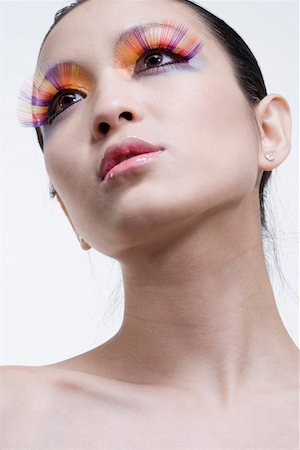 stylish eye makeup - Close-up of a young woman wearing lipstick and false eyelashes Stock Photo - Premium Royalty-Free, Code: 642-01732681