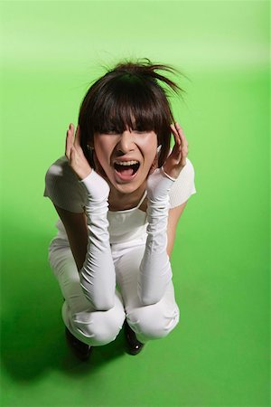 porfiado - Young woman shouting at the camera Foto de stock - Sin royalties Premium, Código: 642-01732713