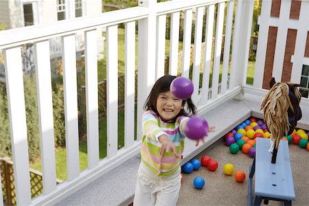simsearch:642-01736683,k - Girl playing with balls, smiling, portrait Stock Photo - Premium Royalty-Free, Code: 642-01732728