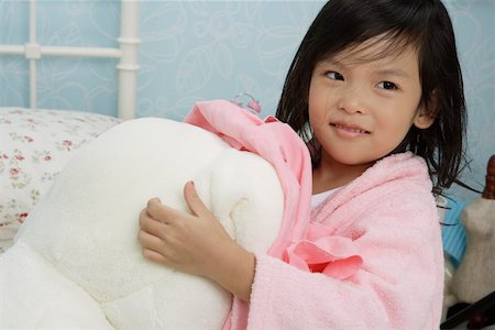 simsearch:642-01732852,k - Girl wearing bathrobe and smiling in bedroom Stock Photo - Premium Royalty-Free, Code: 642-01732732