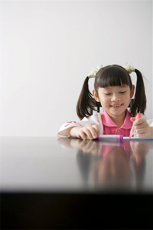 Girl drawing at table Stock Photo - Premium Royalty-Free, Code: 642-01733280