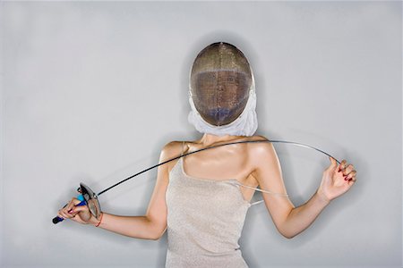 simsearch:642-02004937,k - a fashionable woman with a sword in her hand and a helmet on her head Stock Photo - Premium Royalty-Free, Code: 642-02004915