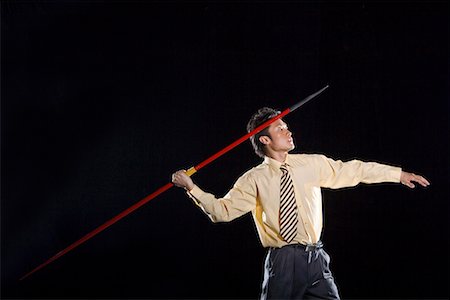 a man in business suit throwing javelin Foto de stock - Sin royalties Premium, Código: 642-02005130