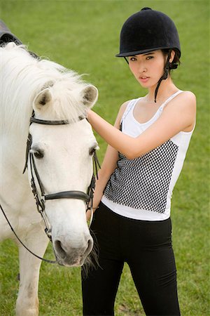 a female horsemanship athlete and her horse Stock Photo - Premium Royalty-Free, Code: 642-02005453