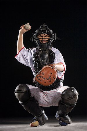 softball - a male softball player Fotografie stock - Premium Royalty-Free, Codice: 642-02005747