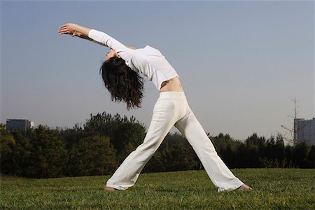 decompression - a Chinese young woman doing yoga Stock Photo - Premium Royalty-Free, Code: 642-02005856