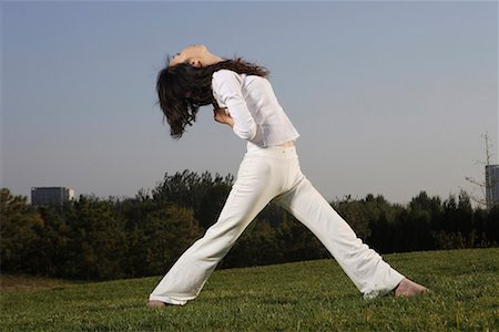 decompression - a Chinese young woman doing yoga Stock Photo - Premium Royalty-Free, Code: 642-02005859