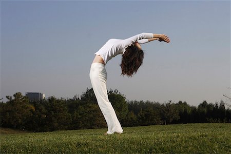 decompression - a Chinese young woman doing yoga Stock Photo - Premium Royalty-Free, Code: 642-02005851