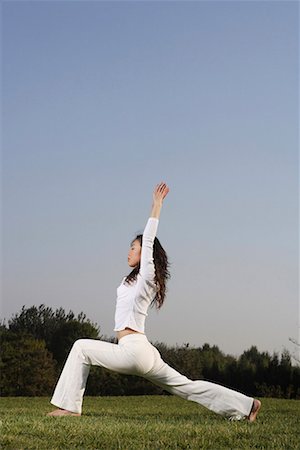 decompression - a Chinese young woman doing yoga Stock Photo - Premium Royalty-Free, Code: 642-02005852