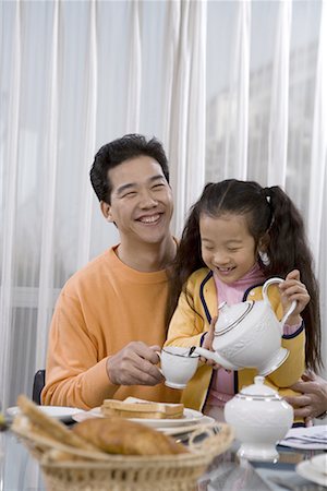 father and his daughter taking breakfast Stock Photo - Premium Royalty-Free, Code: 642-02005940