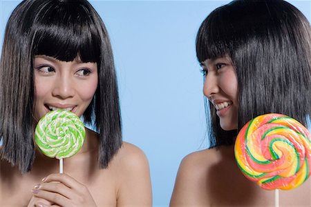simsearch:642-02006591,k - two fashionable girls eating lollipops Stock Photo - Premium Royalty-Free, Code: 642-02006000