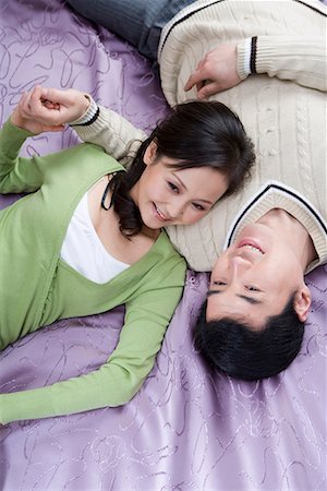 a couple lying on the bed Stock Photo - Premium Royalty-Free, Code: 642-02006132