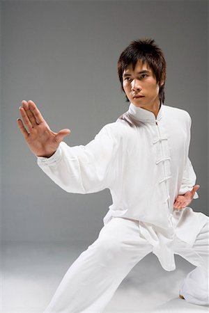 robust - a man practicing Chinese Kungfu Stock Photo - Premium Royalty-Free, Code: 642-02006347