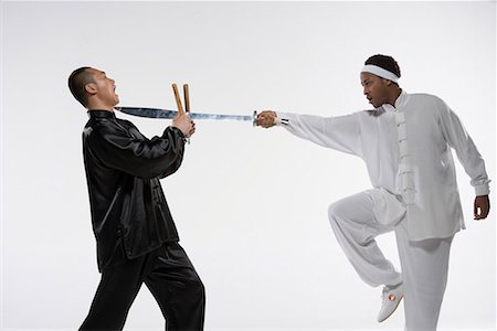 two men practicing Chinese Kungfu Foto de stock - Sin royalties Premium, Código: 642-02006374