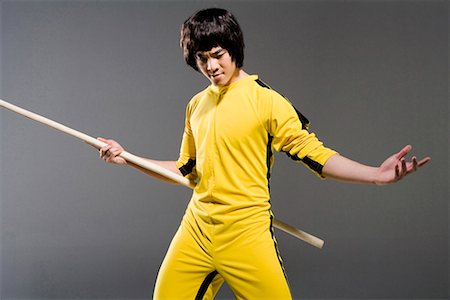 a man practicing a Chinese stick Stock Photo - Premium Royalty-Free, Code: 642-02006429