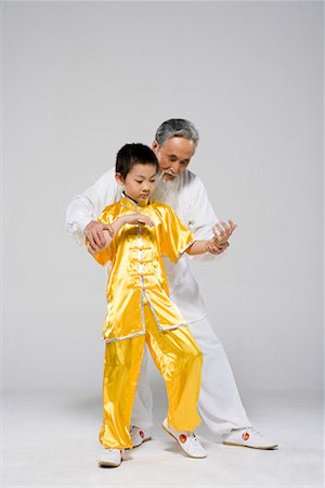 an old man teaching a boy Taiji Stock Photo - Premium Royalty-Free, Code: 642-02006464