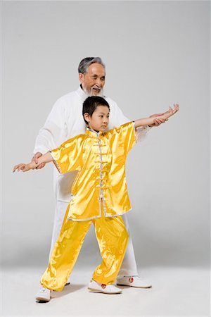 an old man teaching a boy Taiji Stock Photo - Premium Royalty-Free, Code: 642-02006465