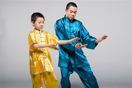 simsearch:642-02006573,k - an man teaching a boy Taiji Stock Photo - Premium Royalty-Free, Code: 642-02006474