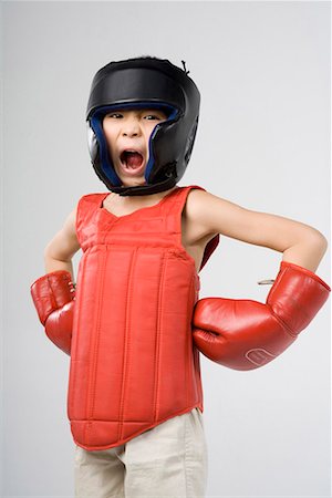 un garçon de pratiquer la boxe Photographie de stock - Premium Libres de Droits, Code: 642-02006505