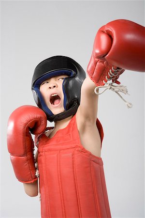a boy practicing boxing Stock Photo - Premium Royalty-Free, Code: 642-02006507