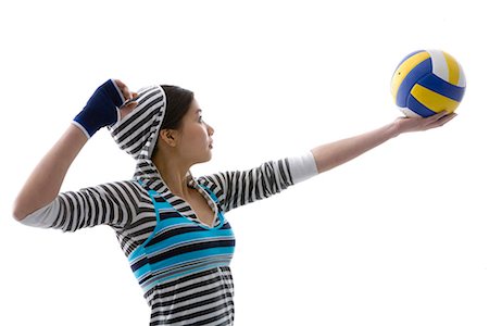 a fashionable woman with a volleyball in her hand Stock Photo - Premium Royalty-Free, Code: 642-02006762