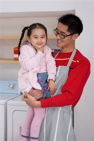 family with washing machine - father and daughter Stock Photo - Premium Royalty-Free, Code: 642-02033651