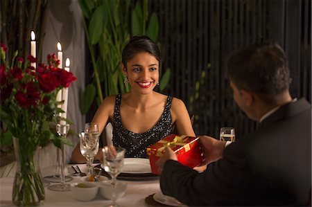 simsearch:655-08356864,k - Singapore, Man giving gift box to woman at romantic dinner Stock Photo - Premium Royalty-Free, Code: 655-08356868