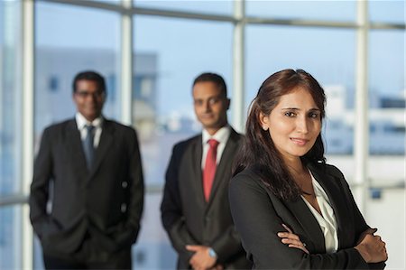 simsearch:655-03458052,k - Singapore, Portrait of businesswoman with colleagues in background Foto de stock - Royalty Free Premium, Número: 655-08356949