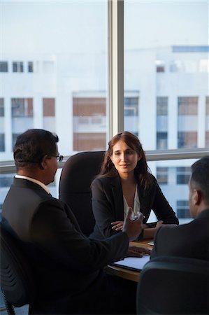 simsearch:655-08357080,k - Singapore, Three business people talking at conference table Stock Photo - Premium Royalty-Free, Code: 655-08356956