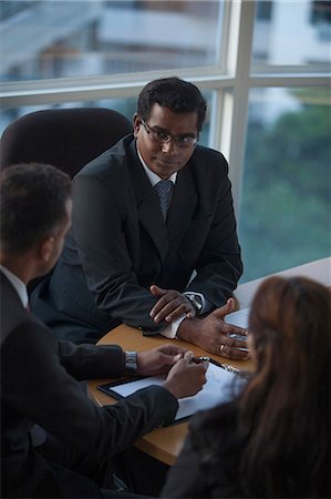 simsearch:655-08357080,k - Singapore, Three business people in discussion Stock Photo - Premium Royalty-Free, Code: 655-08356958