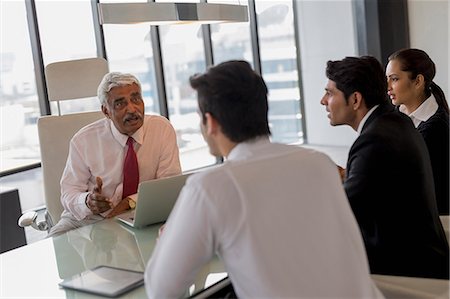 simsearch:655-08357080,k - India, Senior businessman leading discussion with three colleagues Stock Photo - Premium Royalty-Free, Code: 655-08357099