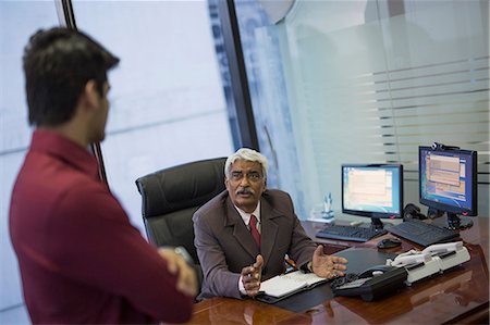 simsearch:655-08357080,k - India, Senior businessman interviewing younger man Stock Photo - Premium Royalty-Free, Code: 655-08357113