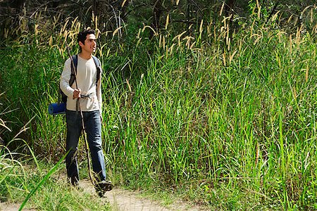 Young man hiking in the wilderness Stock Photo - Premium Royalty-Free, Code: 655-01781469