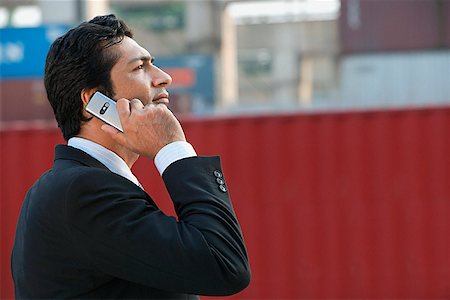 Businessman talking on mobile phone Stock Photo - Premium Royalty-Free, Code: 655-01781580