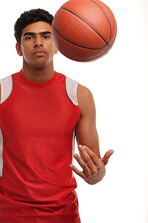 simsearch:656-01767955,k - Young man with basketball looking at camera Foto de stock - Sin royalties Premium, Código: 655-01781594