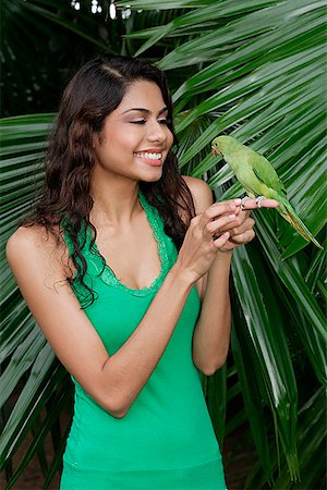 Woman with bird on hand Stock Photo - Premium Royalty-Free, Code: 655-01781659