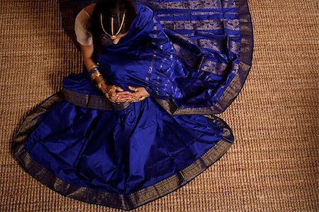 saree style - Indian woman dressed in sari and wedding jewelry Stock Photo - Premium Royalty-Free, Code: 655-02375895