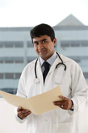 paramedic and doctor - doctor holding patient file Stock Photo - Premium Royalty-Free, Code: 655-02702909
