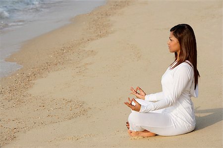 exotic relaxing - woman practicing yoga at the beach Stock Photo - Premium Royalty-Free, Code: 655-02702901