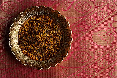 exotic - Indian digestive mukhwa seeds on brass dish on pink sari cloth Stock Photo - Premium Royalty-Free, Code: 655-02702992