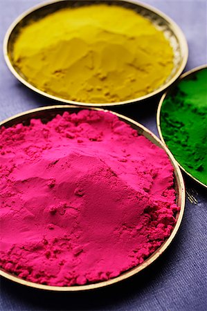 dyeing colorful pic - pink, yellow and green Indian powder paints closeup Stock Photo - Premium Royalty-Free, Code: 655-02703041