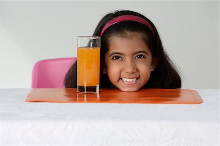 simsearch:655-02883054,k - Girl with glass of juice Foto de stock - Royalty Free Premium, Número: 655-02883044
