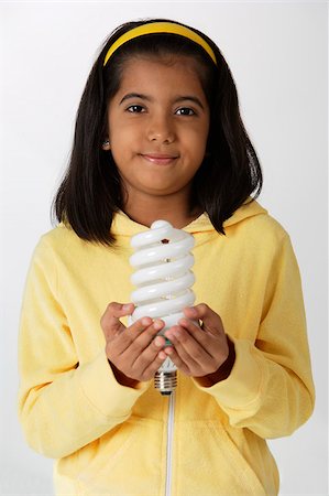 simsearch:655-02883054,k - Girl holding light bulb Foto de stock - Royalty Free Premium, Número: 655-02883049