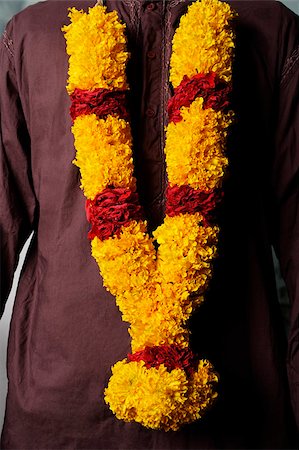 singapore traditional clothes - Man wearing flower garlands. Stock Photo - Premium Royalty-Free, Code: 655-03082793