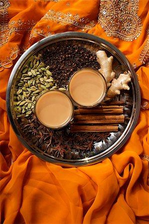 singapore traditional clothes - Indian masala tea with spices on silver tray. Stock Photo - Premium Royalty-Free, Code: 655-03082834