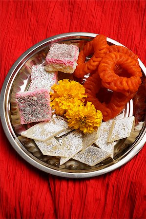 Assorted Indian sweets on silver tray. Stock Photo - Premium Royalty-Free, Code: 655-03082844