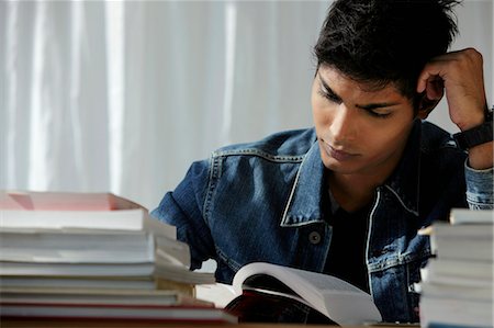 simsearch:655-02375870,k - young man reading a book, studying Stock Photo - Premium Royalty-Free, Code: 655-03519665