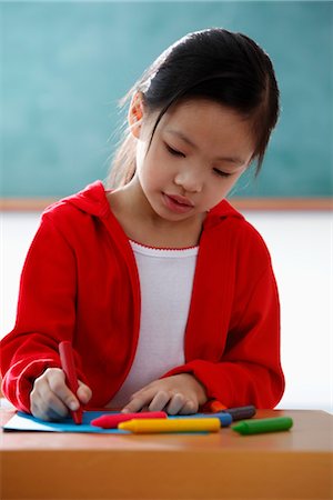 simsearch:6116-07085230,k - Young girl coloring with crayons Stock Photo - Premium Royalty-Free, Code: 656-04926511